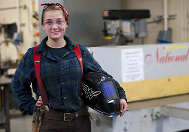 Photo of woman welding student